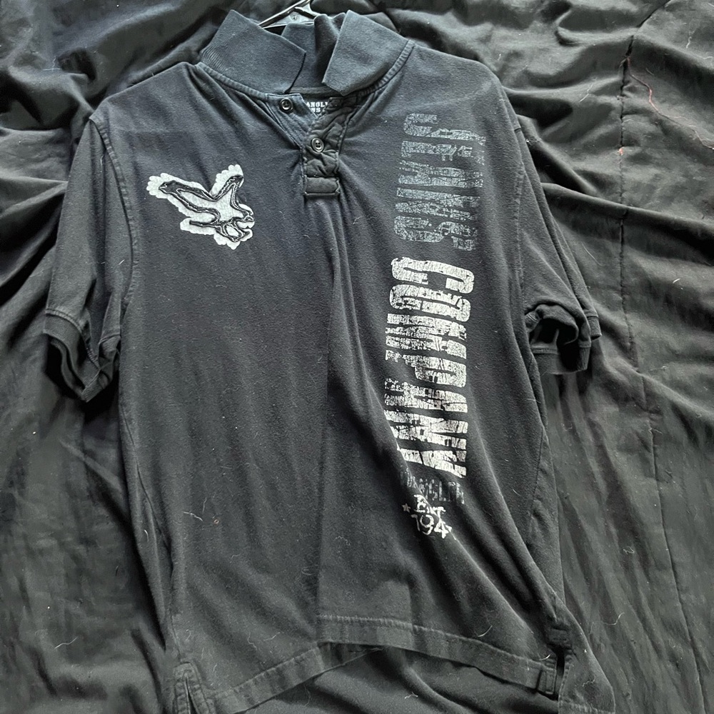 Collared shirt with a rare tear theme